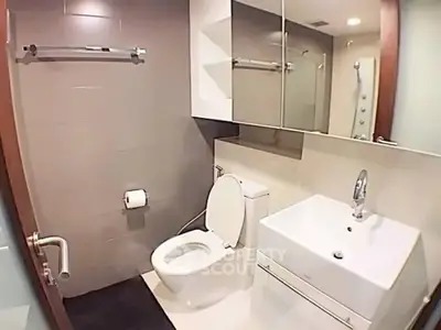 Modern bathroom with sleek fixtures and ample lighting