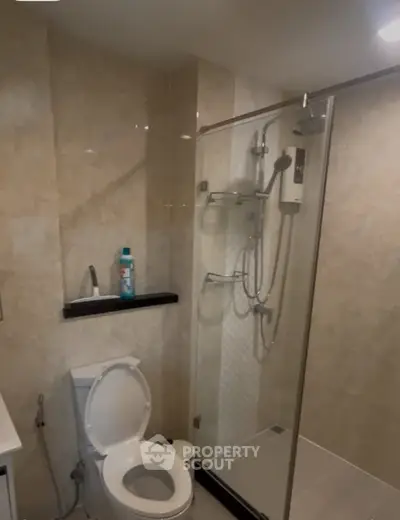 Modern bathroom with glass shower and sleek fixtures