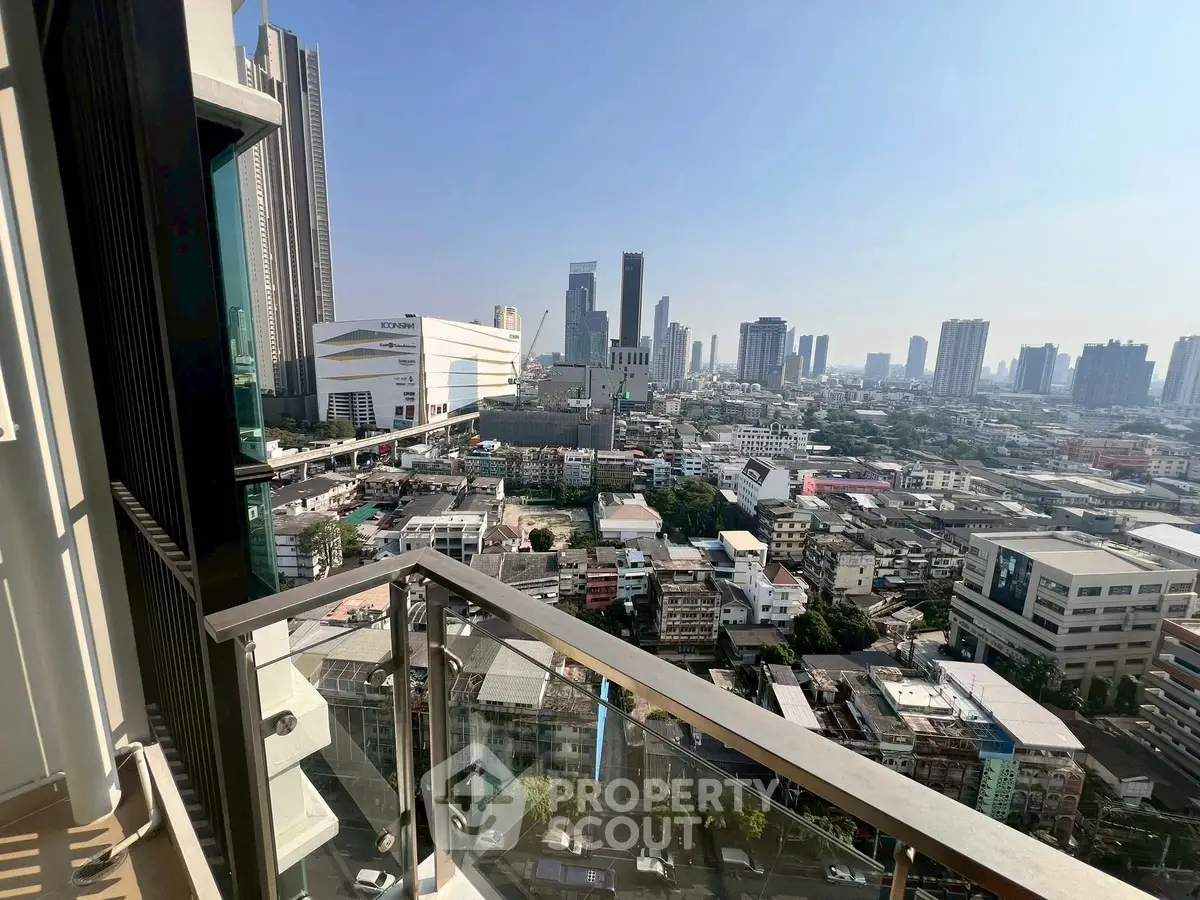 Stunning cityscape view from a high-rise balcony with modern urban skyline.