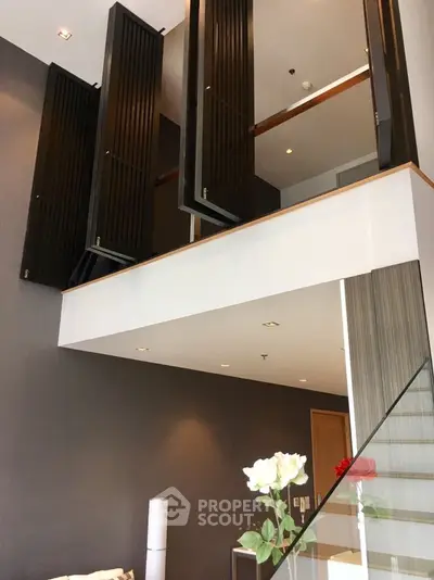 Modern duplex interior with high ceilings and elegant design