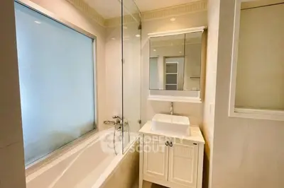 Elegant bathroom with modern bathtub and stylish vanity