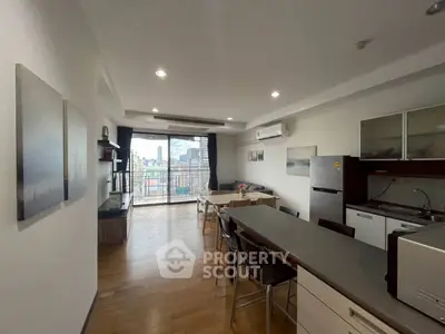 Spacious modern kitchen with open layout and city view balcony