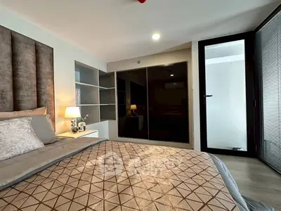 Modern bedroom with stylish decor and ample storage space