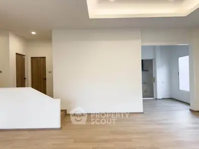 Spacious modern living room with open layout and wooden flooring