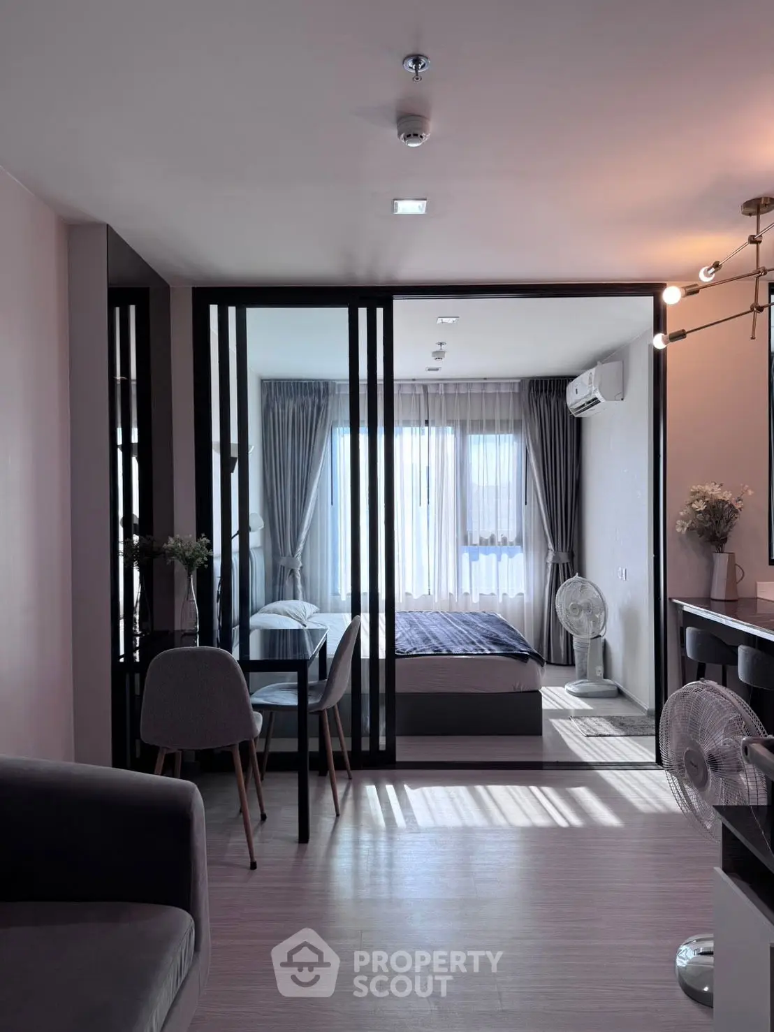 Modern living room with stylish decor and ample natural light