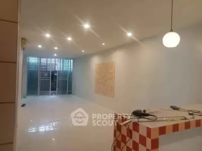 Spacious modern living room with sleek lighting and open layout