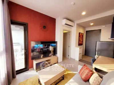 Modern living room with stylish decor, featuring a wall-mounted TV, air conditioning, and natural light.