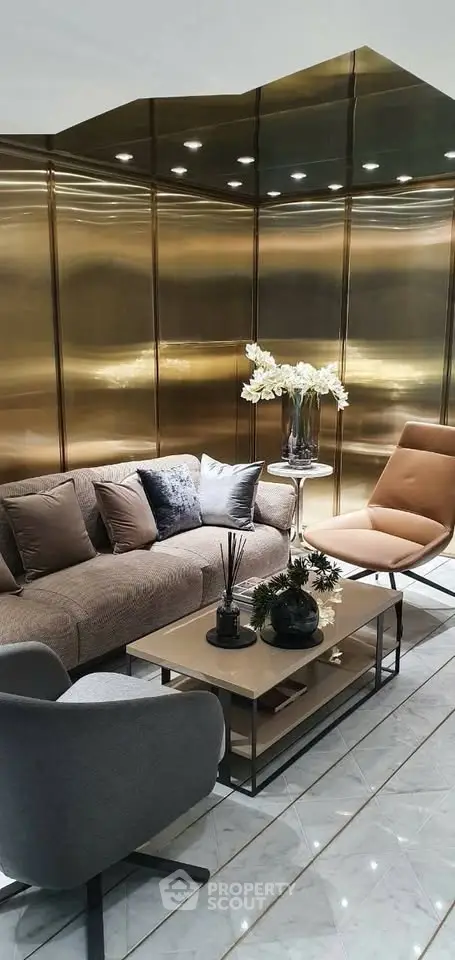 Luxurious modern living room with elegant furniture and golden wall panels, perfect for sophisticated living.