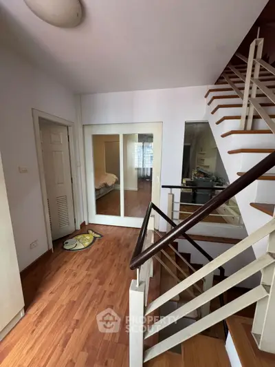 Modern living room with stylish decor and wooden flooring