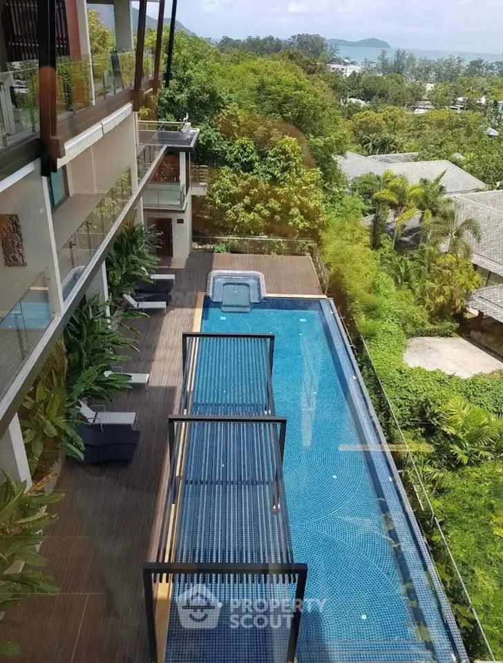 Luxurious property with stunning pool and lush greenery view