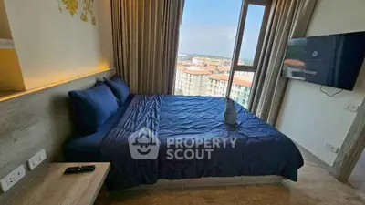 Luxurious bedroom with stunning city view and modern amenities