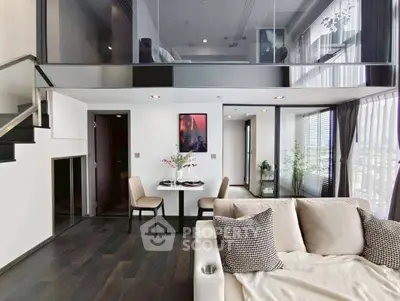 Luxurious modern loft with mezzanine bedroom and stylish living area, featuring floor-to-ceiling windows and elegant decor.