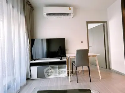 Modern living room with sleek TV setup and air conditioning, perfect for urban lifestyle.