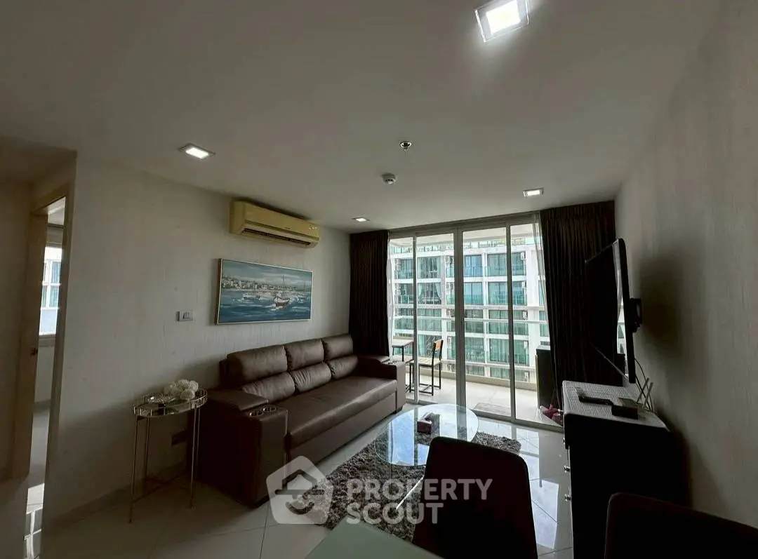 Modern living room with balcony view in a high-rise apartment