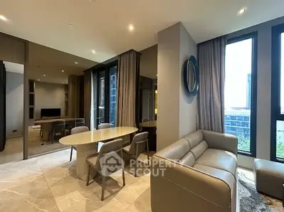 Modern living room with elegant dining area and large windows offering city views.