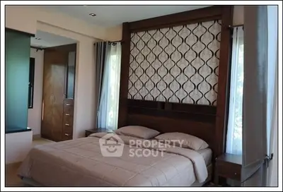 Luxurious bedroom with elegant decor and ample natural light