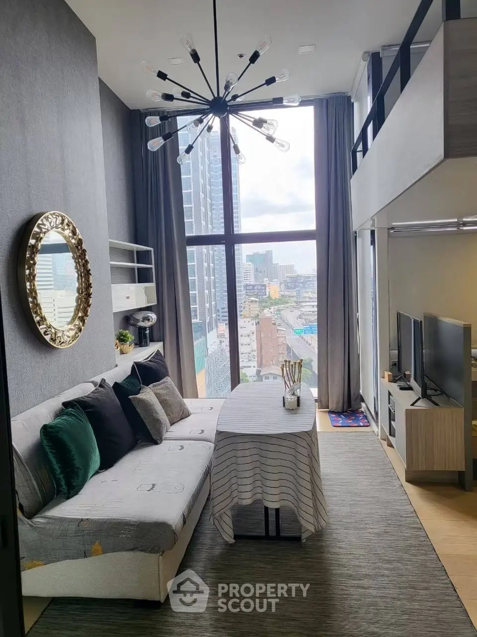 Modern loft-style living room with high ceiling and city view