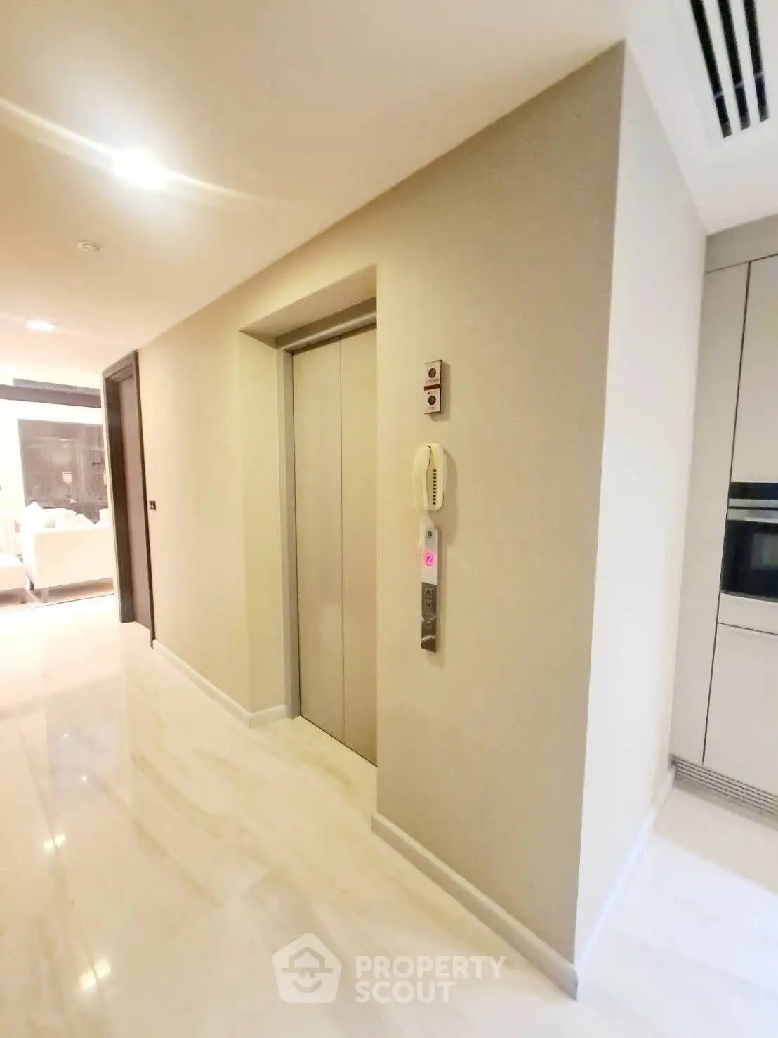 Modern apartment hallway with elevator and sleek interior design