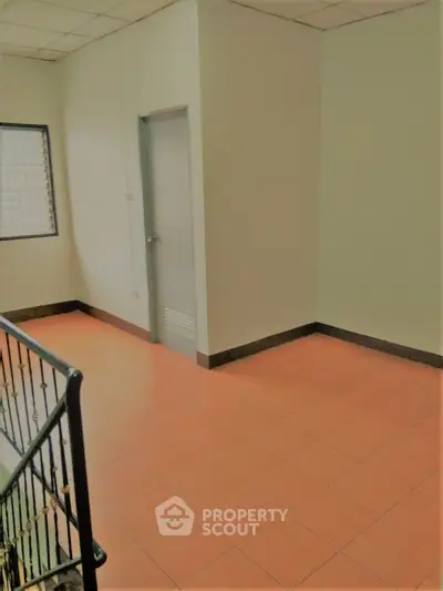 Spacious and well-lit corner unit with terracotta tiled flooring and a neutral color palette, perfect for custom interior design.