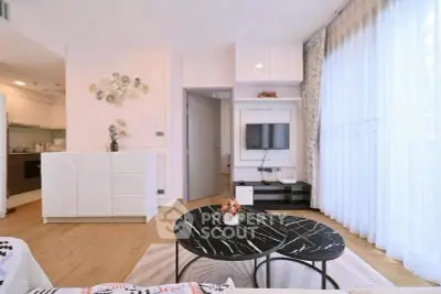 Modern living room with stylish decor and open kitchen layout