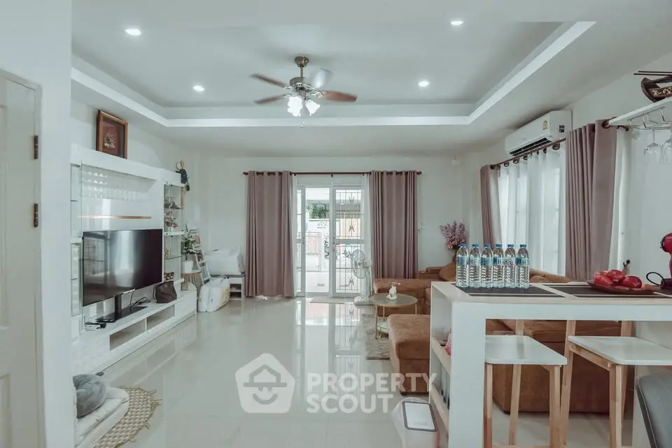 Spacious modern living room with elegant decor and natural light