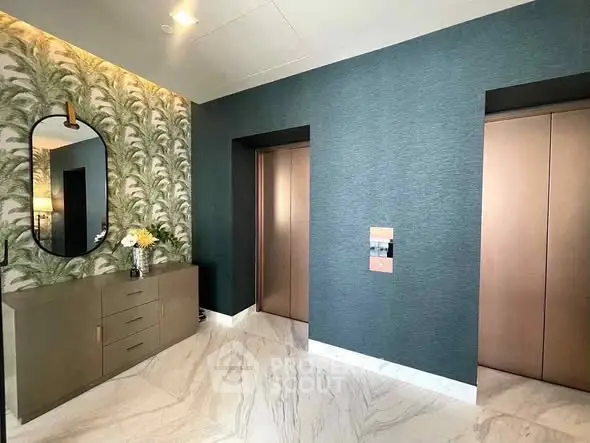 Luxurious modern elevator lobby with elegant decor and marble flooring
