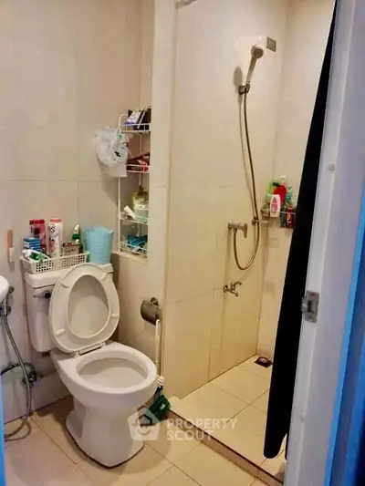 Compact bathroom with shower and toilet in modern apartment