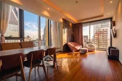 Luxurious living room with stunning city view and elegant wooden flooring