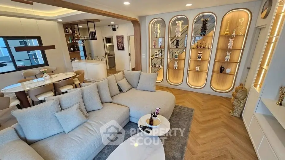 Luxurious living room with modern decor and elegant display shelves