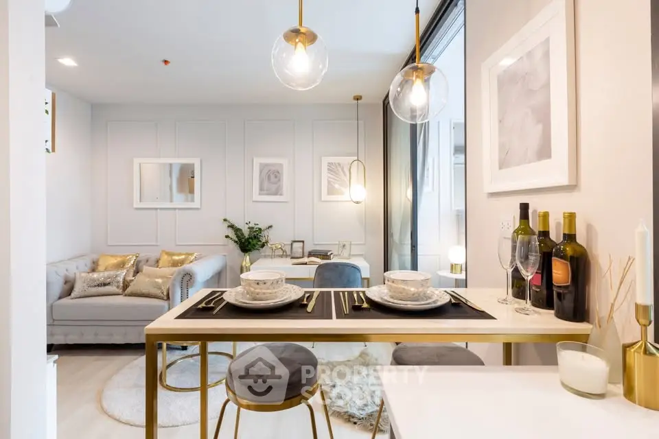 Modern open-plan living and dining area with elegant decor and stylish lighting.