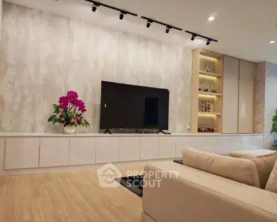 Modern living room with sleek TV setup and elegant decor