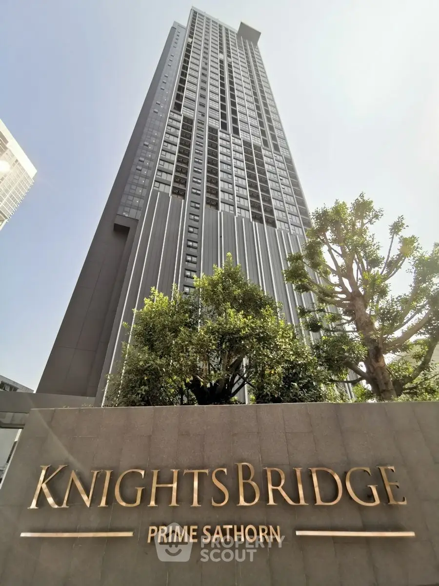 Stunning high-rise building Knightsbridge Prime Sathorn with lush greenery and modern architecture.