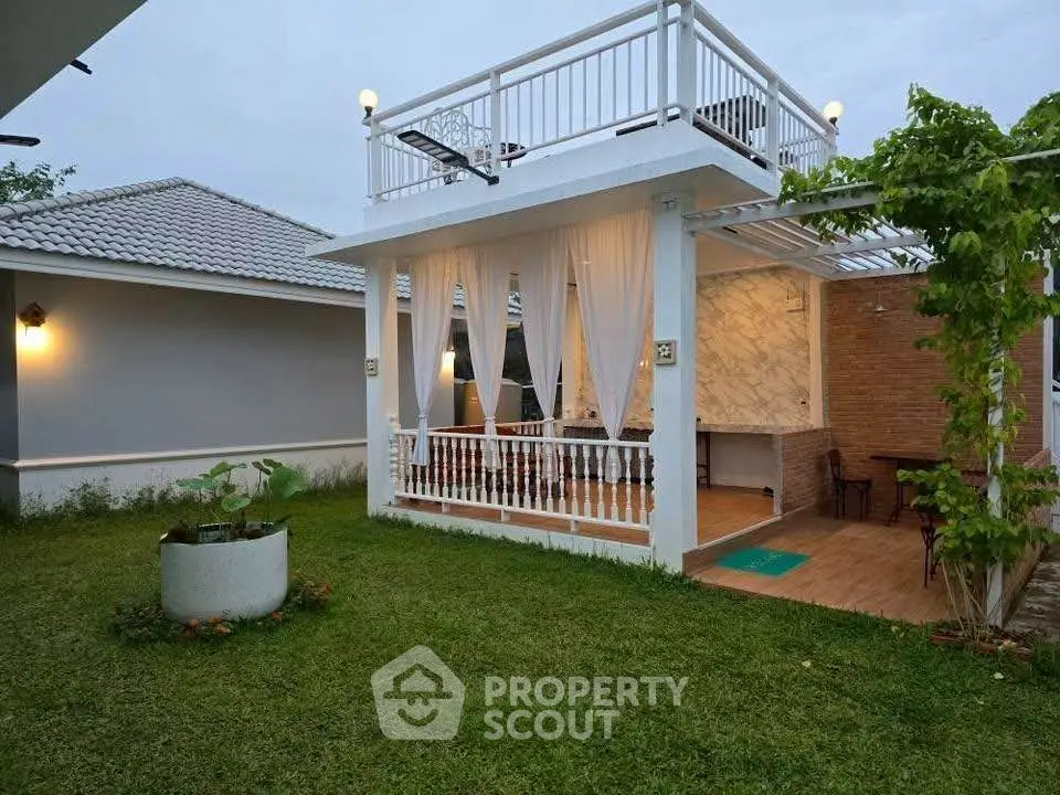 Charming garden view with elegant outdoor patio and rooftop terrace, perfect for relaxation.