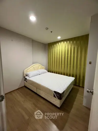Cozy bedroom with modern design and comfortable bed in a stylish apartment.