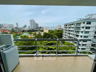 Spacious balcony with city view in modern apartment building