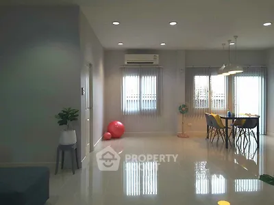 Spacious modern living room with dining area and natural light