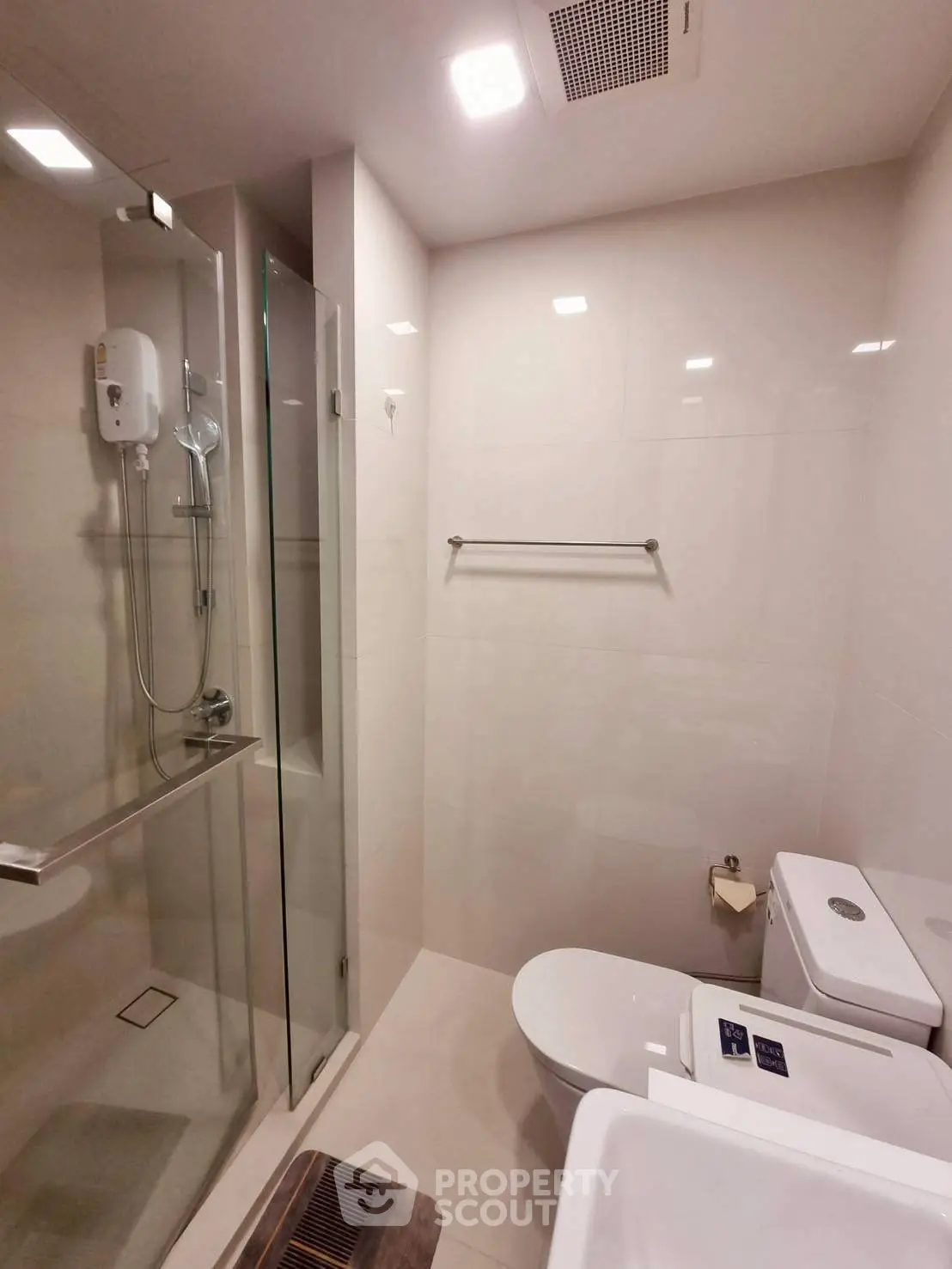 Modern bathroom with glass shower and sleek fixtures