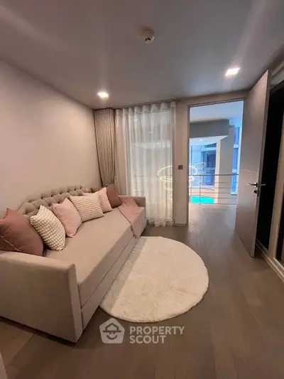 Stylish living room with modern decor and cozy seating in a contemporary apartment.