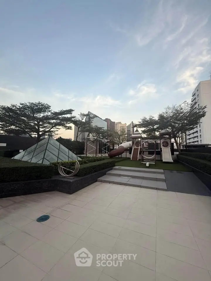Stunning rooftop playground with modern design and city views, perfect for family living.