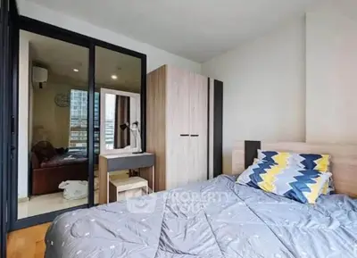 Modern bedroom with stylish decor and ample natural light in urban apartment