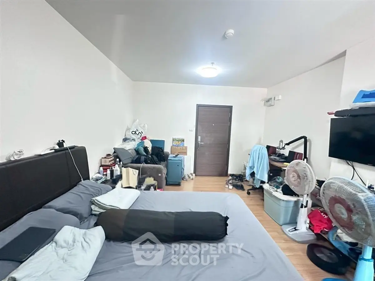 Spacious bedroom with modern decor and ample storage space, perfect for comfortable living.