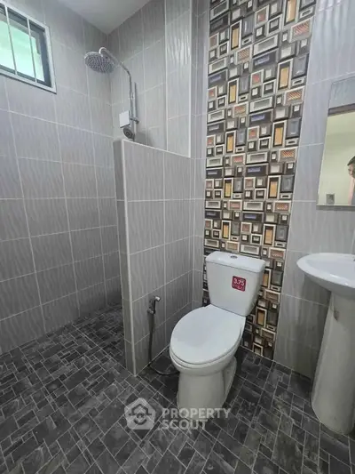 Modern bathroom with stylish tile design and sleek fixtures