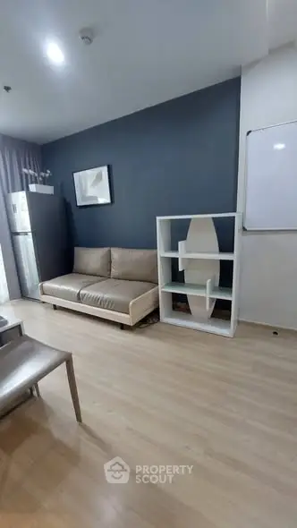 Modern living room with sleek furniture and stylish decor in a contemporary apartment.