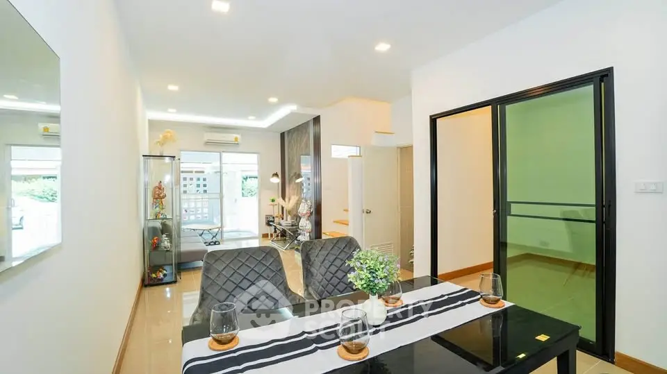 Modern dining area with elegant decor and open layout in a stylish apartment.