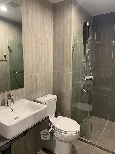 Modern bathroom with sleek design and glass shower enclosure