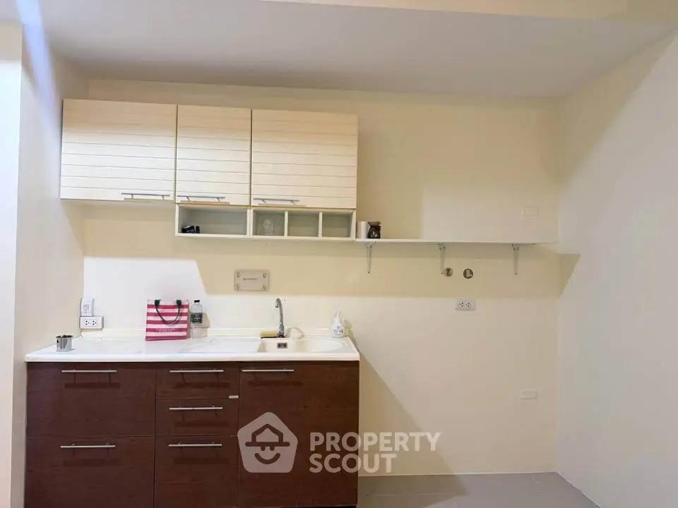Modern kitchen with sleek cabinets and open shelving