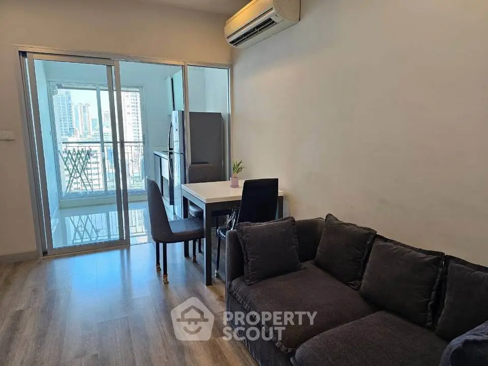Modern living room with balcony view in urban apartment