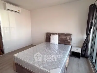 Modern bedroom with air conditioning and natural light