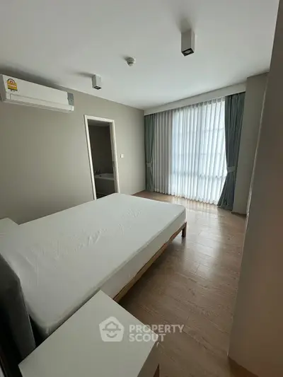 Spacious bedroom with modern design and natural light