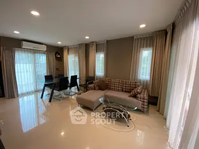 Spacious living room with modern furniture and natural light